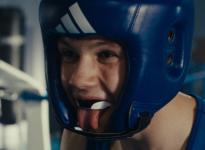 A boxer sticking out his tongue in close-up