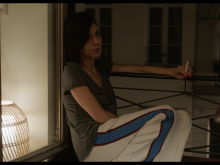 Amal smoking next to her appartment window ©Scope Pictures