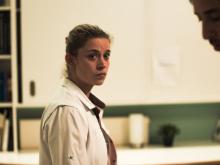 Female character in smock looking at male character also in smock © wrong men