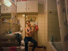 A girl taking a selfie wearing a bra in her bathroom (still 3)