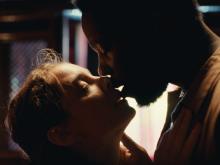 A man and a woman kissing (still 5)