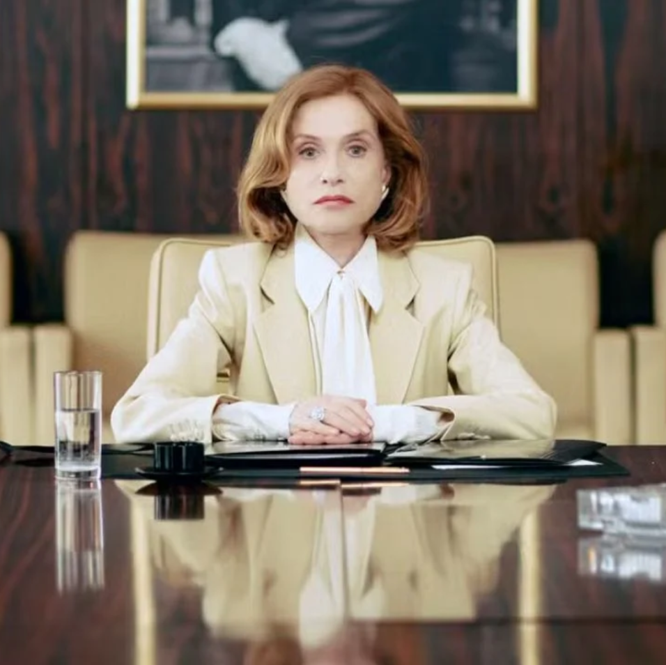 Rich and class lady sitting in front of a luxurious desk