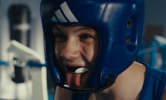 A boxer sticking out his tongue in close-up